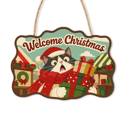 Tuxedo Cat Gift Delivery paint by numbers hanging sign – Startled tuxedo cat in a Santa hat carrying gifts past market stalls, with Welcome Christmas lettering, on a wooden sign with a rope hanger