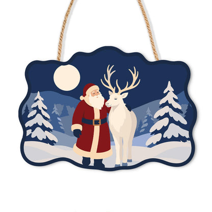 Moonlit Santa and White Reindeer paint by numbers hanging sign – Santa standing beside a white reindeer under a full moon among snowy pines, on a wooden sign with a rope hanger