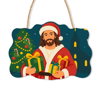 Jesus in Santa Hat Bearing Gifts paint by numbers hanging sign – Jesus in a Santa hat and red coat holding wrapped gifts beside a Christmas tree and church, on a wooden sign with a rope hanger
