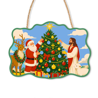 Santa and Jesus Trim the Tree paint by numbers hanging sign – Santa and Jesus decorating a starred Christmas tree, with a wreathed reindeer and a lamb under blue sky, on a wooden sign with a rope hanger
