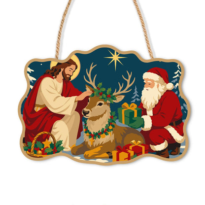 Kneeling by the Resting Reindeer paint by numbers hanging sign – Haloed Jesus and Santa kneeling beside a resting reindeer in a wreath under a bright star, with gifts, on a wooden sign with a rope hanger