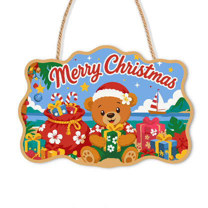 Beachside Teddy with Gift Sack paint by numbers hanging sign – Teddy bear in a Santa hat on a sunny beach with a red gift sack, presents and a sailboat at sea, on a wooden sign with a rope hanger