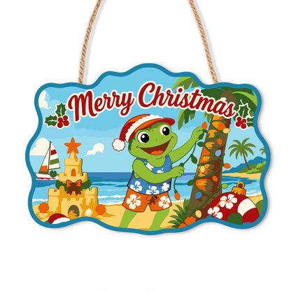 Frog Stringing Palm Lights paint by numbers hanging sign – Frog in a Santa hat and swim trunks decorating a palm tree with lights beside a sandcastle and sailboat, on a wooden sign with a rope hanger