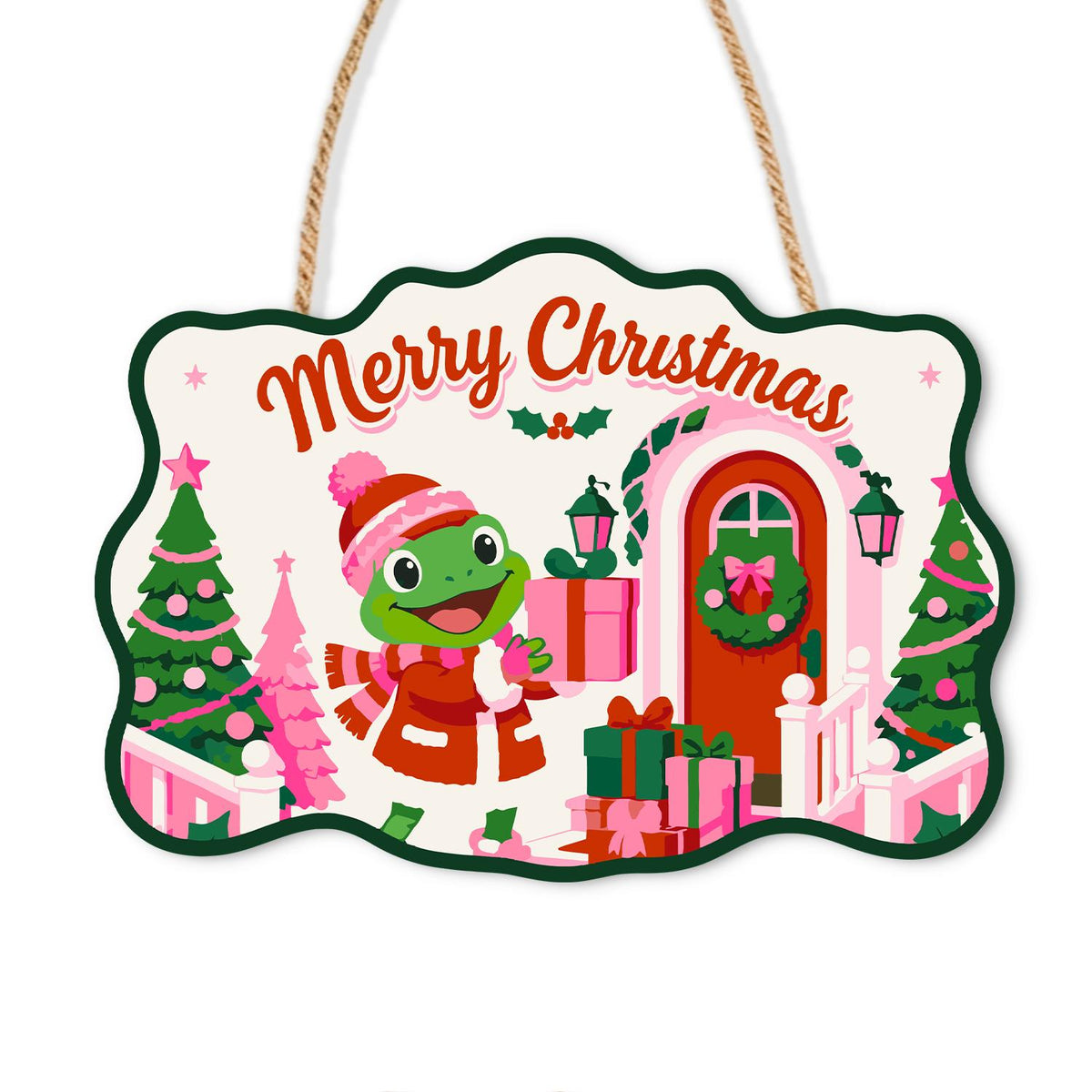 Pink Cottage Frog with a Gift paint by numbers hanging sign – Frog in a pink knit hat and red coat holding a gift beside a pink house with a wreath and pink Christmas trees, on a wooden sign with a rope hanger