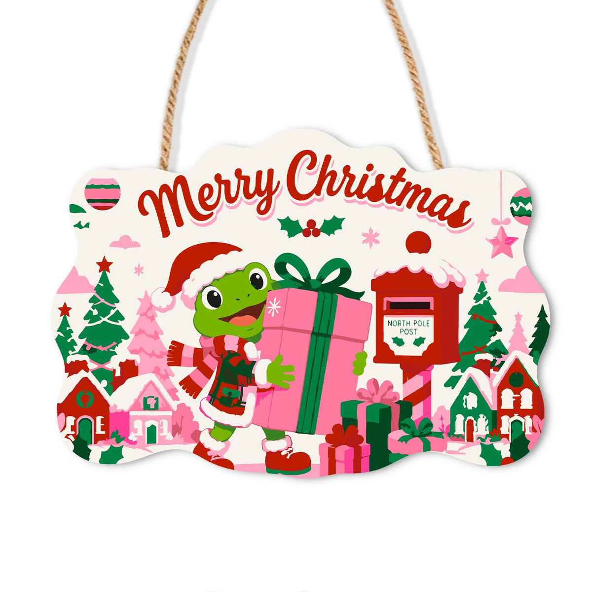 Frog Hauling a Big Pink Present paint by numbers hanging sign – Frog in a Santa hat carrying a giant pink gift beside a red North Pole mailbox and a pink village, on a wooden sign with a rope hanger