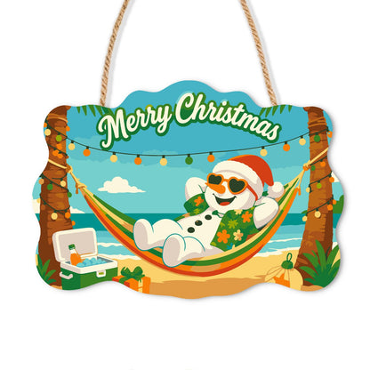 Hammock Snowman Under Lights paint by numbers hanging sign – Snowman in a Santa hat, sunglasses and floral shirt relaxing in a hammock under string lights on the beach, on a wooden sign with a rope hanger