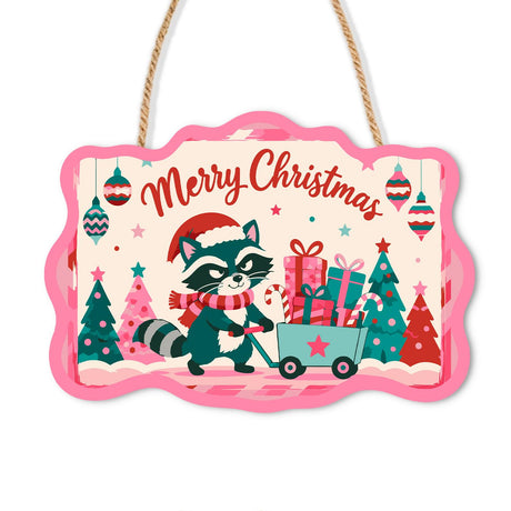 Raccoon Hauling a Gift Wagon paint by numbers hanging sign – Raccoon in a Santa hat and scarf pulling a green wagon of presents between pink and green trees, on a wooden sign with a rope hanger