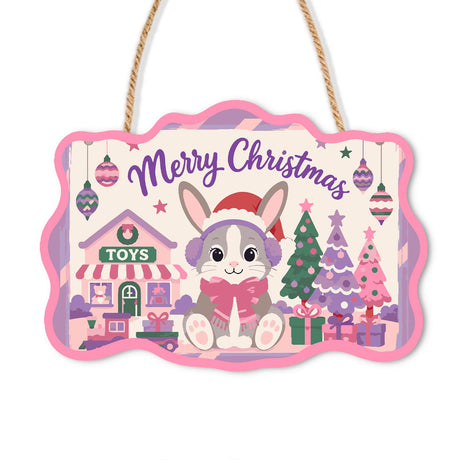 Earmuff Bunny at the Toy Shop paint by numbers hanging sign – Grey bunny in earmuffs and a pink scarf outside a toy shop with lavender and pink Christmas trees, on a wooden sign with a rope hanger