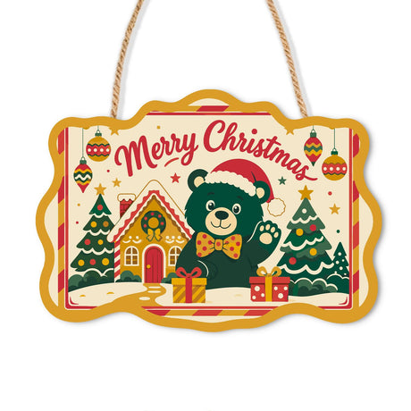Bow Tie Bear's Gingerbread Wave paint by numbers hanging sign – Dark green bear in a Santa hat and orange bow tie waving beside a gingerbread house and Christmas trees, on a wooden sign with a rope hanger