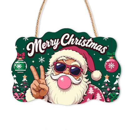 Pink-Coat Santa's Gum Bubble paint by numbers hanging sign – Santa in sunglasses and a pink coat blowing a pink bubble gum bubble and flashing a peace gesture, on a wooden sign with a rope hanger
