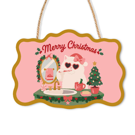 White Cat Brushing Its Teeth paint by numbers hanging sign – White cat in a pink Santa hat and heart sunglasses brushing its teeth at a sink with a wreath-trimmed mirror, on a wooden sign with a rope hanger