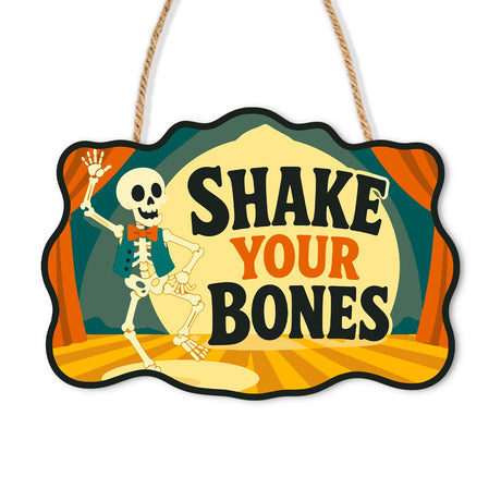 Dancing Skeleton in the Spotlight paint by numbers hanging sign – Skeleton in a red bow tie dancing on a curtained stage in a spotlight, lettered Shake Your Bones, on a wooden sign with a rope hanger