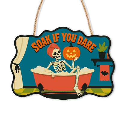 Skeleton's Bubble Bath Soak paint by numbers hanging sign – Skeleton in a hair towel relaxing in a red clawfoot tub of bubbles, holding a jack-o'-lantern, Soak If You Dare, on a wooden sign with a rope hanger
