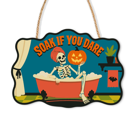 Skeleton's Bubble Bath Soak paint by numbers hanging sign – Skeleton in a hair towel relaxing in a red clawfoot tub of bubbles, holding a jack-o'-lantern, Soak If You Dare, on a wooden sign with a rope hanger