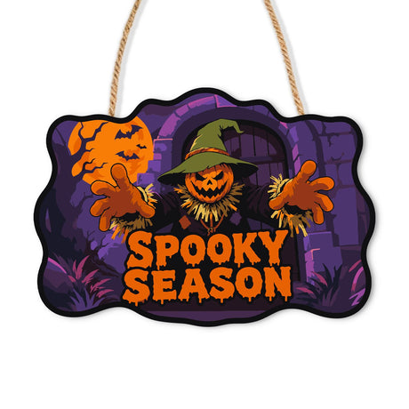 Purple Arch Pumpkin Scarecrow paint by numbers hanging sign – Pumpkin-head scarecrow in a green witch hat with arms wide before a purple stone arch and bats, Spooky Season, on a wooden sign with a rope hanger
