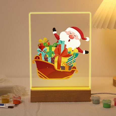Santa's Sleigh Piled with Presents paint by numbers light-up sign – Waving Santa riding a red sleigh piled high with wrapped presents, lit up on its wooden base