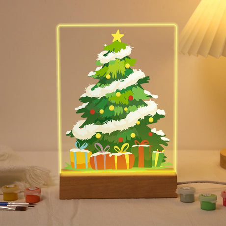 Tinsel-Wrapped Christmas Tree paint by numbers light-up sign – Green Christmas tree wrapped in white tinsel garland with a gold star, colored ornaments and gifts underneath, lit up on its wooden base