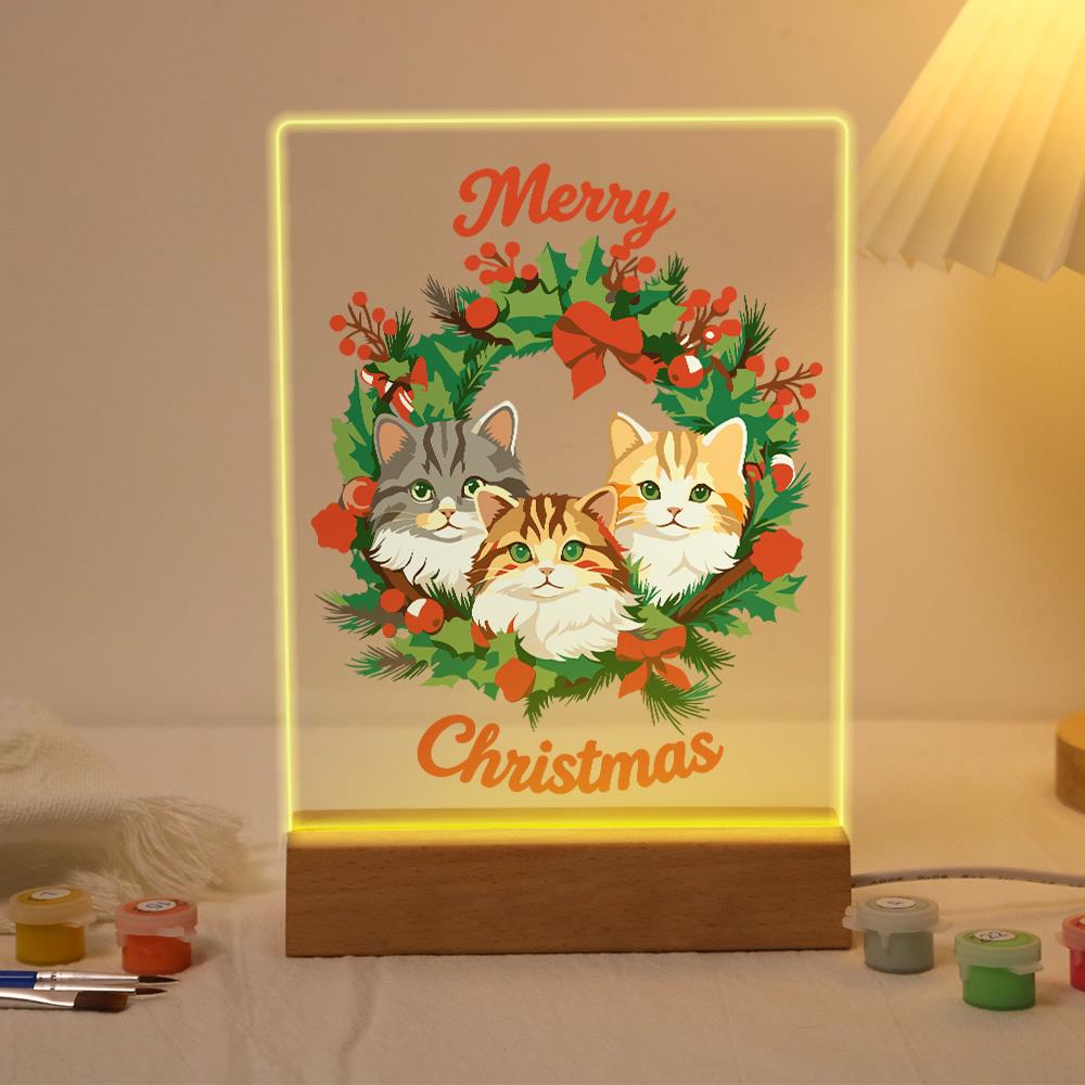 Three Cats in a Holly Wreath paint by numbers light-up sign – Three tabby cats, gray, ginger and cream, peeking out of a holly and berry wreath, Merry Christmas lettering, lit up on its wooden base