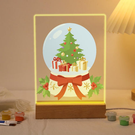 Ribbon-Tied Snow Globe Tree paint by numbers light-up sign – Snow globe holding a Christmas tree and wrapped gifts, its base tied with a big red bow and trimmed with holly, lit up on its wooden base