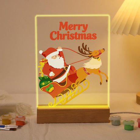 Reindeer Pulling Santa's Sleigh paint by numbers light-up sign – Santa riding a red sleigh full of gifts pulled by a leaping reindeer, Merry Christmas lettering above, lit up on its wooden base