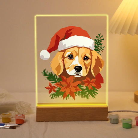 Golden Pup in Poinsettias paint by numbers light-up sign – Golden long-eared puppy wearing a Santa hat above red poinsettias and pine branches, lit up on its wooden base