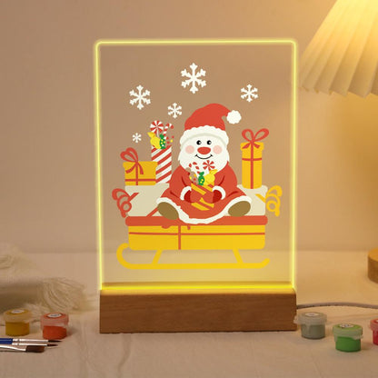 Santa's Candy-Cane Sleigh paint by numbers light-up sign – Round-faced Santa sitting in a golden sleigh piled with gifts and candy canes under falling snowflakes, lit up on its wooden base
