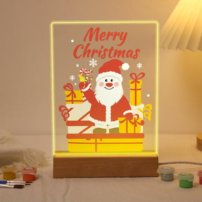 Waving Santa with Stacked Gifts paint by numbers light-up sign – Rosy-cheeked Santa waving a candy cane behind a stack of wrapped gifts, Merry Christmas lettering, lit up on its wooden base