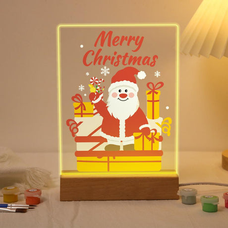 Waving Santa with Stacked Gifts paint by numbers light-up sign – Rosy-cheeked Santa waving a candy cane behind a stack of wrapped gifts, Merry Christmas lettering, lit up on its wooden base