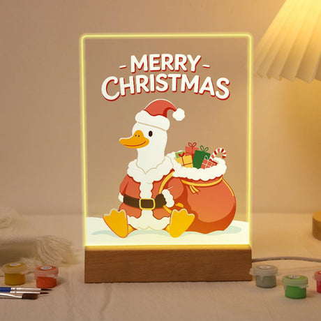 Duck with Santa's Gift Sack paint by numbers light-up sign – White duck in a Santa suit and hat sitting beside a big orange sack overflowing with gifts, Merry Christmas lettering, lit up on its wooden base