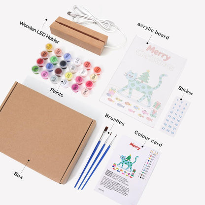Spotted Cat Carrying a Tiny Tree paint by numbers light-up sign – what's in the kit: the acrylic sheet, wooden LED base, numbered paints and brushes