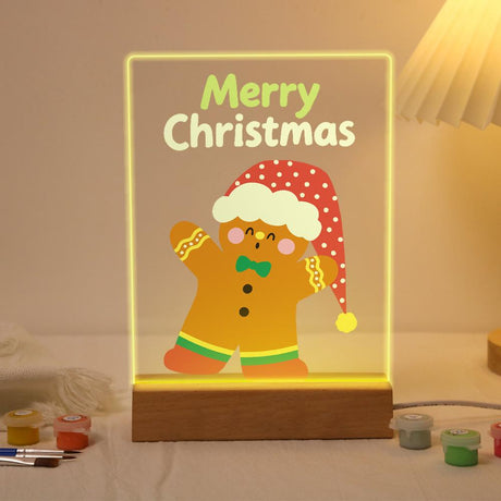 Gingerbread Man in a Floppy Hat paint by numbers light-up sign – Smiling gingerbread man in a long red polka-dot Santa hat and green bow tie, Merry Christmas lettering above, lit up on its wooden base