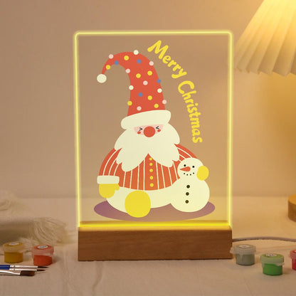 Tall-Hat Santa and Tiny Snowman paint by numbers light-up sign – Bearded Santa in a tall red polka-dot hat and striped coat sitting beside a small snowman, Merry Christmas lettering, lit up on its wooden base