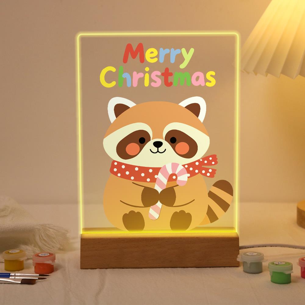 Candy Cane Raccoon paint by numbers light-up sign – Smiling raccoon in a red polka-dot scarf holding a candy cane below colorful Merry Christmas letters, lit up on its wooden base