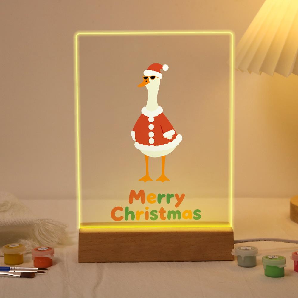 Tall Goose in a Santa Suit paint by numbers light-up sign – White long-necked goose in a red Santa coat and hat standing above Merry Christmas lettering, lit up on its wooden base