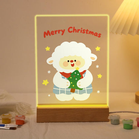 Lamb in Plaid Hugging a Tree paint by numbers light-up sign – Fluffy sheep in a plaid outfit hugging a small Christmas tree below Merry Christmas lettering, lit up on its wooden base