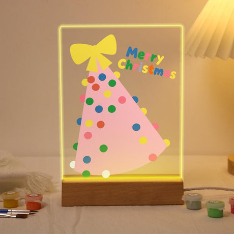 Tilted Pink Tree with Yellow Bow paint by numbers light-up sign – Tilted pink Christmas tree covered in colorful polka dots with a big yellow bow on top, lit up on its wooden base