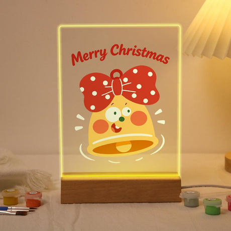 Ringing Bell with a Red Bow paint by numbers light-up sign – Smiling yellow bell with a big red polka-dot bow ringing below Merry Christmas lettering, lit up on its wooden base