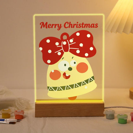 Surprised Bell with Zigzag Trim paint by numbers light-up sign – Wide-eyed yellow bell with a red polka-dot bow and green zigzag trim below Merry Christmas lettering, lit up on its wooden base