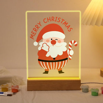 Winking Santa with a Candy Cane paint by numbers light-up sign – Winking Santa waving a mitten and holding a candy cane below arched Merry Christmas lettering, lit up on its wooden base