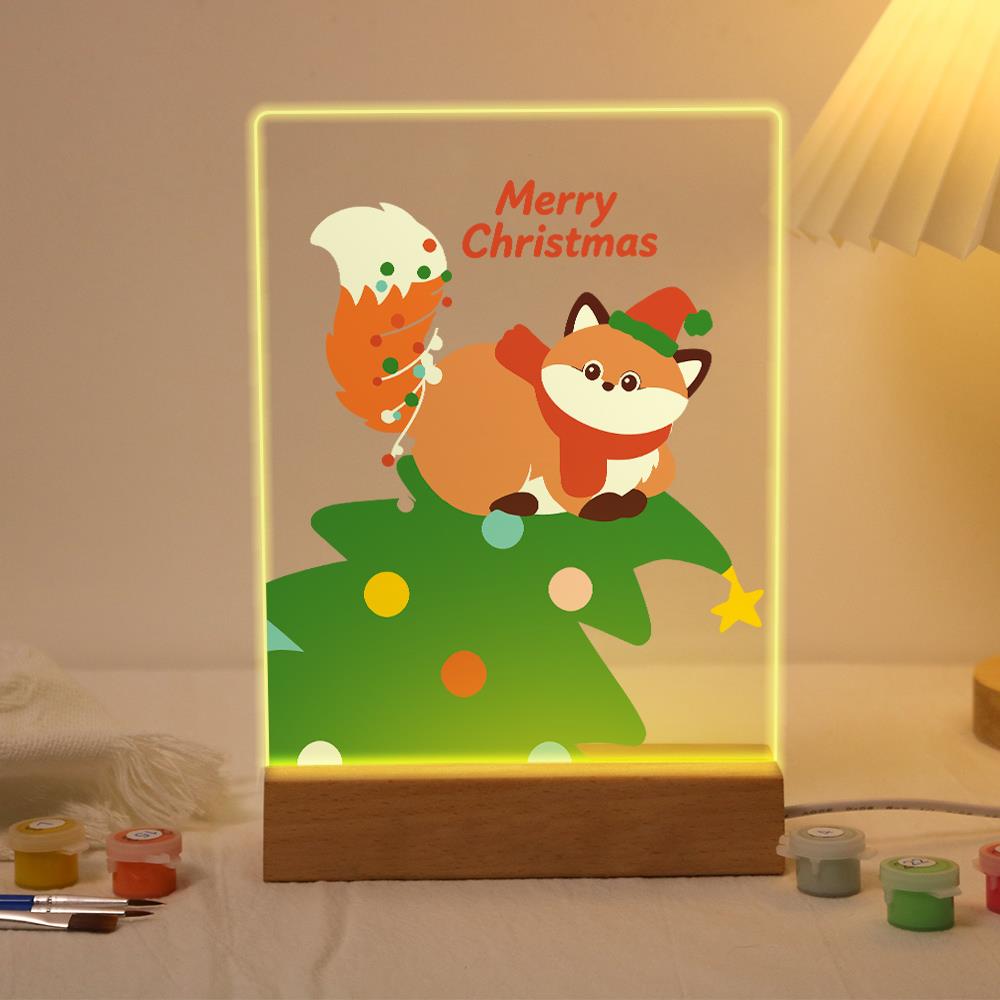 Fox Resting on a Christmas Tree paint by numbers light-up sign – Fox in a green elf hat and red scarf lying on top of a Christmas tree with a garland-wrapped tail, lit up on its wooden base