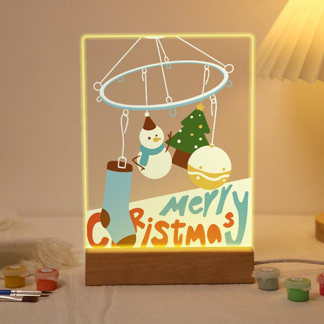 Christmas Mobile with Stocking paint by numbers light-up sign – Hanging ring mobile holding a stocking, snowman, little tree and bauble above big Merry Christmas letters, lit up on its wooden base