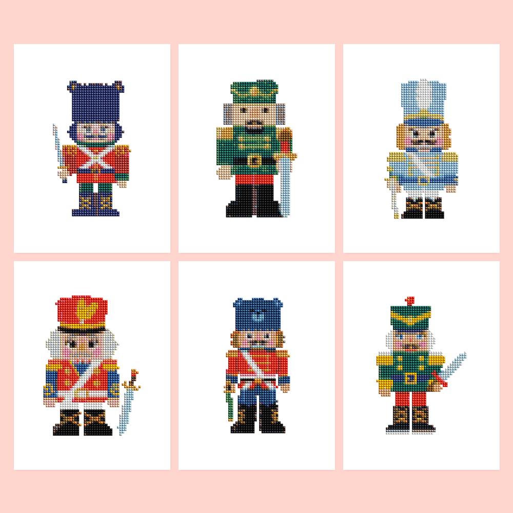 Red Coat Nutcracker Guard mini diamond painting – Six traditional nutcracker soldiers in red, navy and green uniforms with tall hats, some holding swords