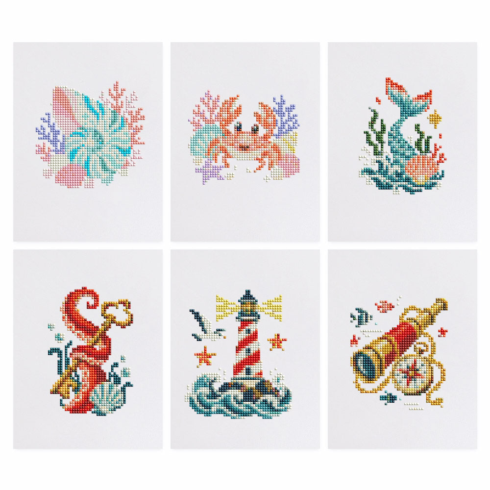 Mermaid Tail and Coral Treasures mini diamond painting – Seashell and crab with coral, a mermaid tail, a red seahorse, a striped lighthouse and a brass spyglass