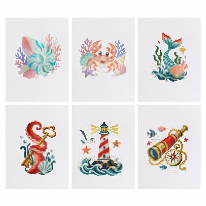 Mermaid Tail and Coral Treasures mini diamond painting – Seashell and crab with coral, a mermaid tail, a red seahorse, a striped lighthouse and a brass spyglass