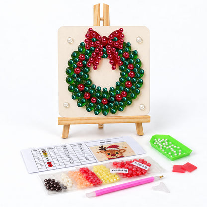 Evergreen Wreath with a Red Bow pearl painting easel kit – Round green evergreen wreath topped with a big red bow