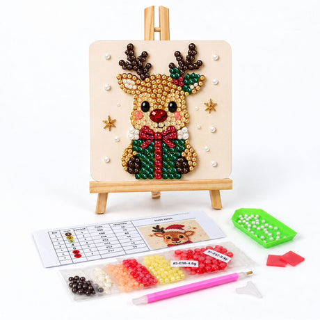 Reindeer Hugging a Green Gift pearl painting easel kit – Reindeer with holly on one antler holding a green present tied with a red bow