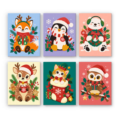 Kitten in a Stocking and Pals mini paint by numbers – Fox, penguin, polar bear, fawn, kitten in a stocking and owl in Santa hats framed by holly
