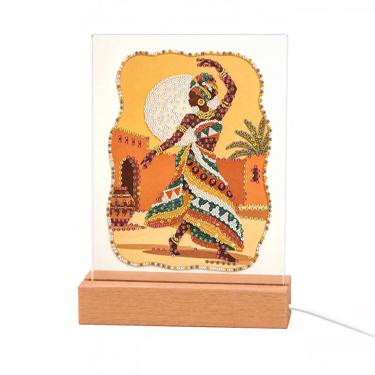 Dancer in a Bold Patterned Gown light-up pearl painting – Woman in a headwrap and bold patterned dress dancing before a golden full moon and earthen adobe walls