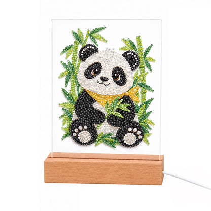 Panda in a Bamboo Grove light-up pearl painting – Smiling panda with a yellow scarf sitting among green bamboo stalks and leaves