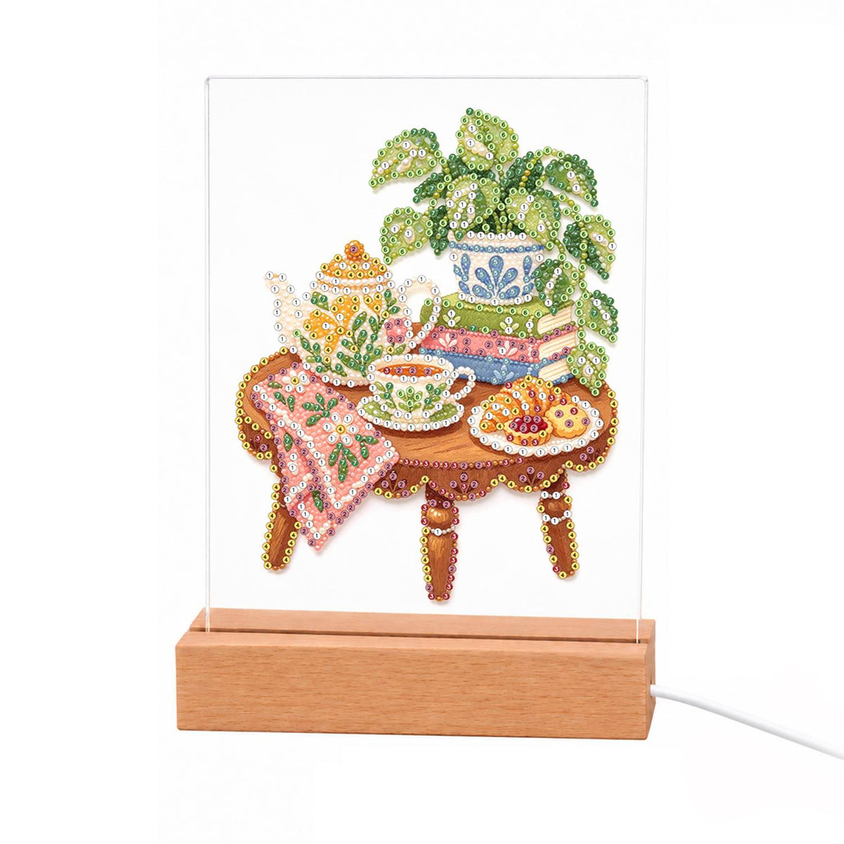 Afternoon Tea on a Pink Cloth light-up pearl painting – Teapot, teacup and pastries on a pink-draped table with a potted plant on stacked books